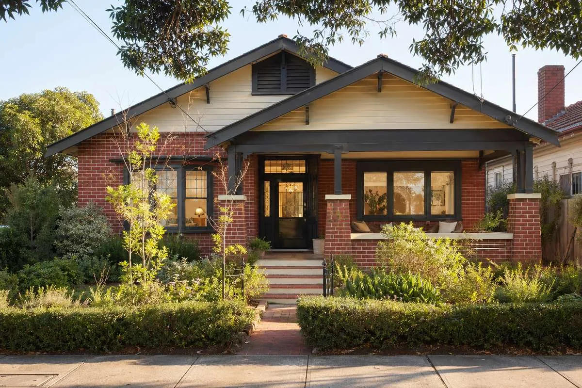 Custom-built Californian Bungalow home in Melbourne with wide verandah and clinker brick facade