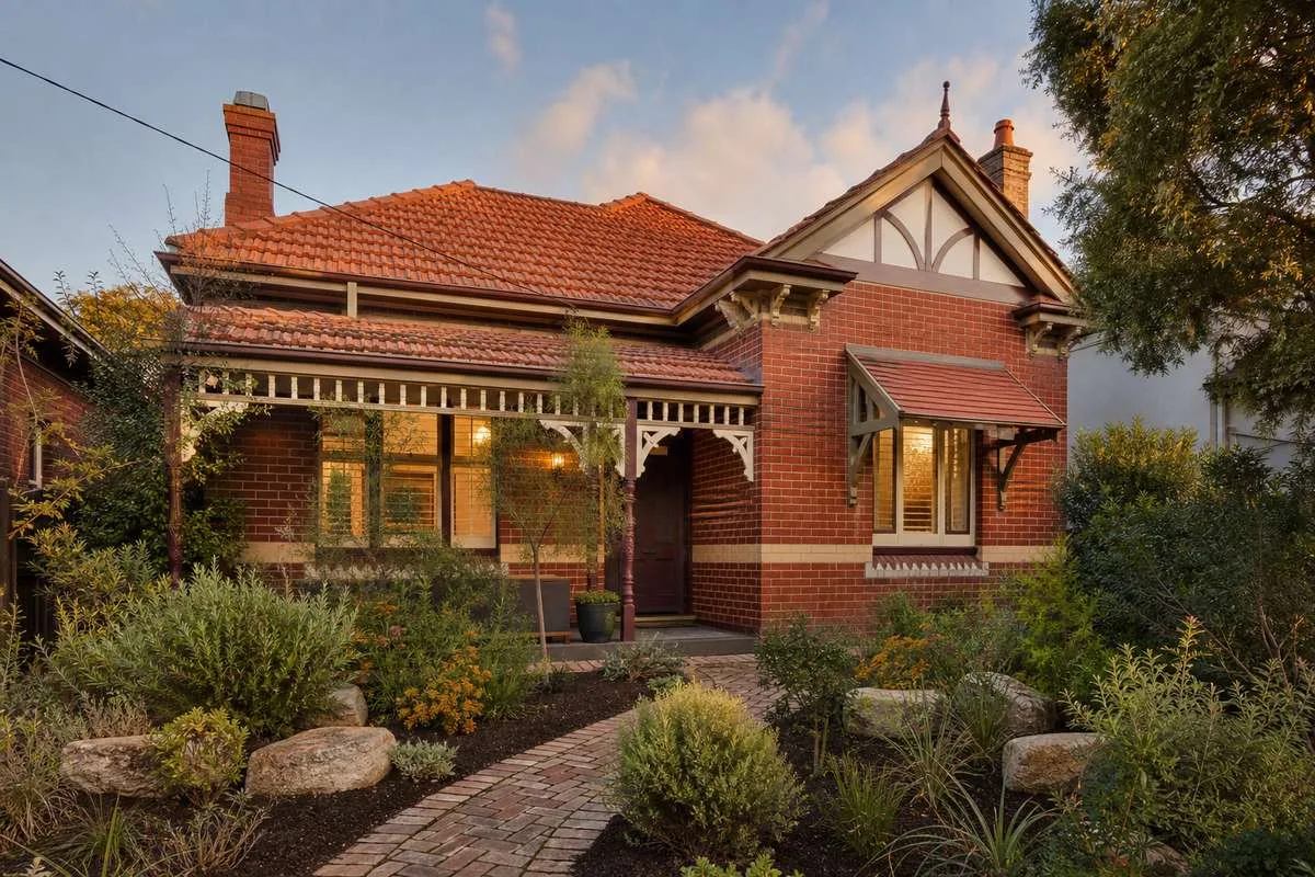 Completed Federation-style custom home in Melbourne with ornate heritage verandah, built by Australian Heritage Homes