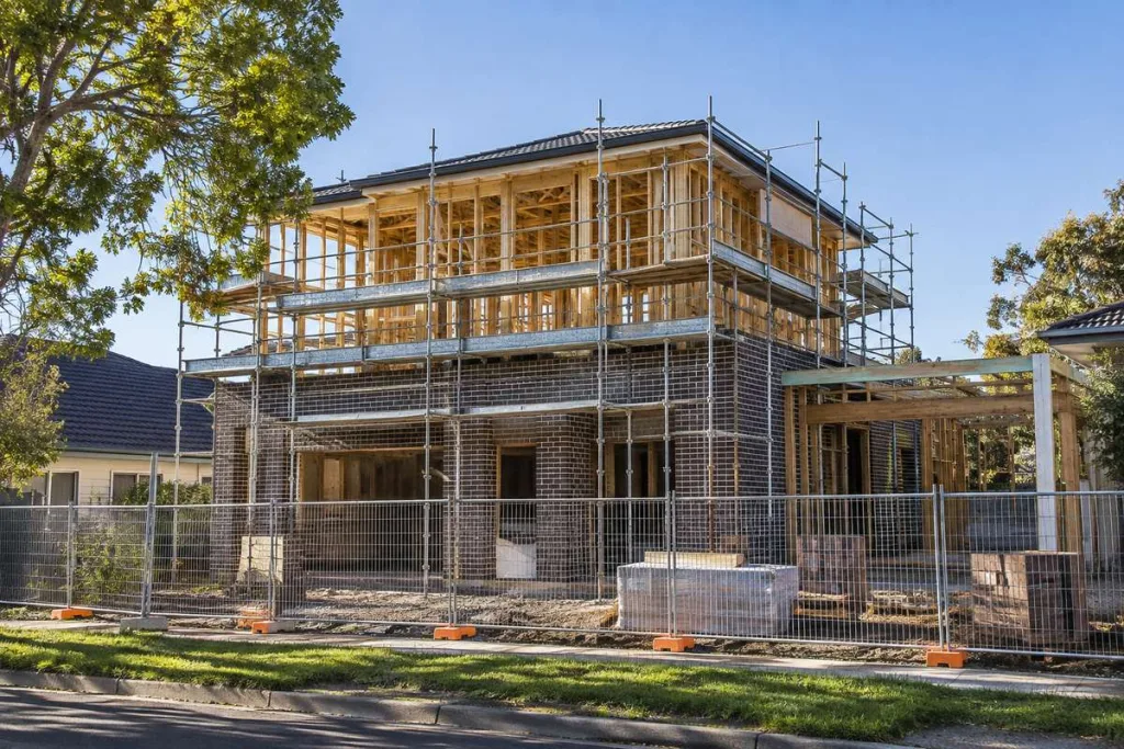 Melbourne knock-down rebuild construction site with new custom home frame and brickwork
